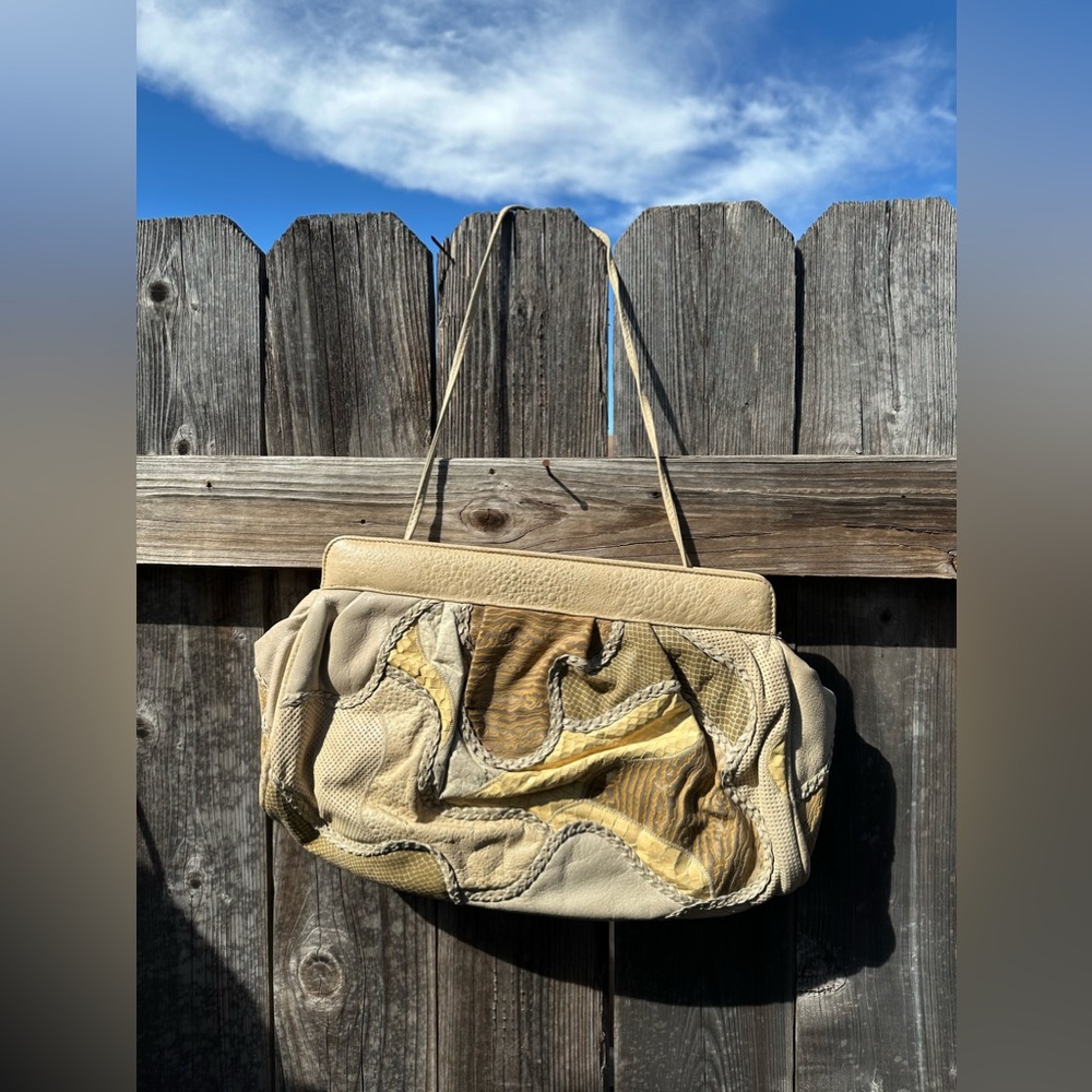 Super on trend! Vintage 80’s adjustable length strap or clutch bag.